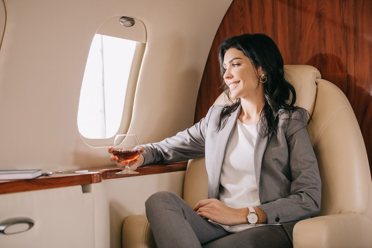 VIP woman sitting in private jet